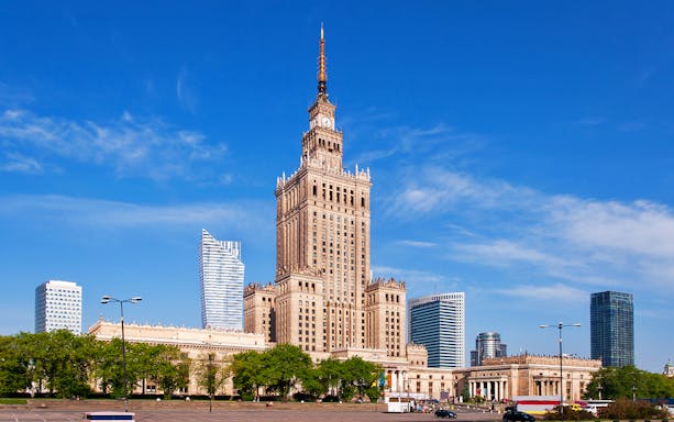 Warsaw Palace of Culture and Science with surrounding skyscrapers.