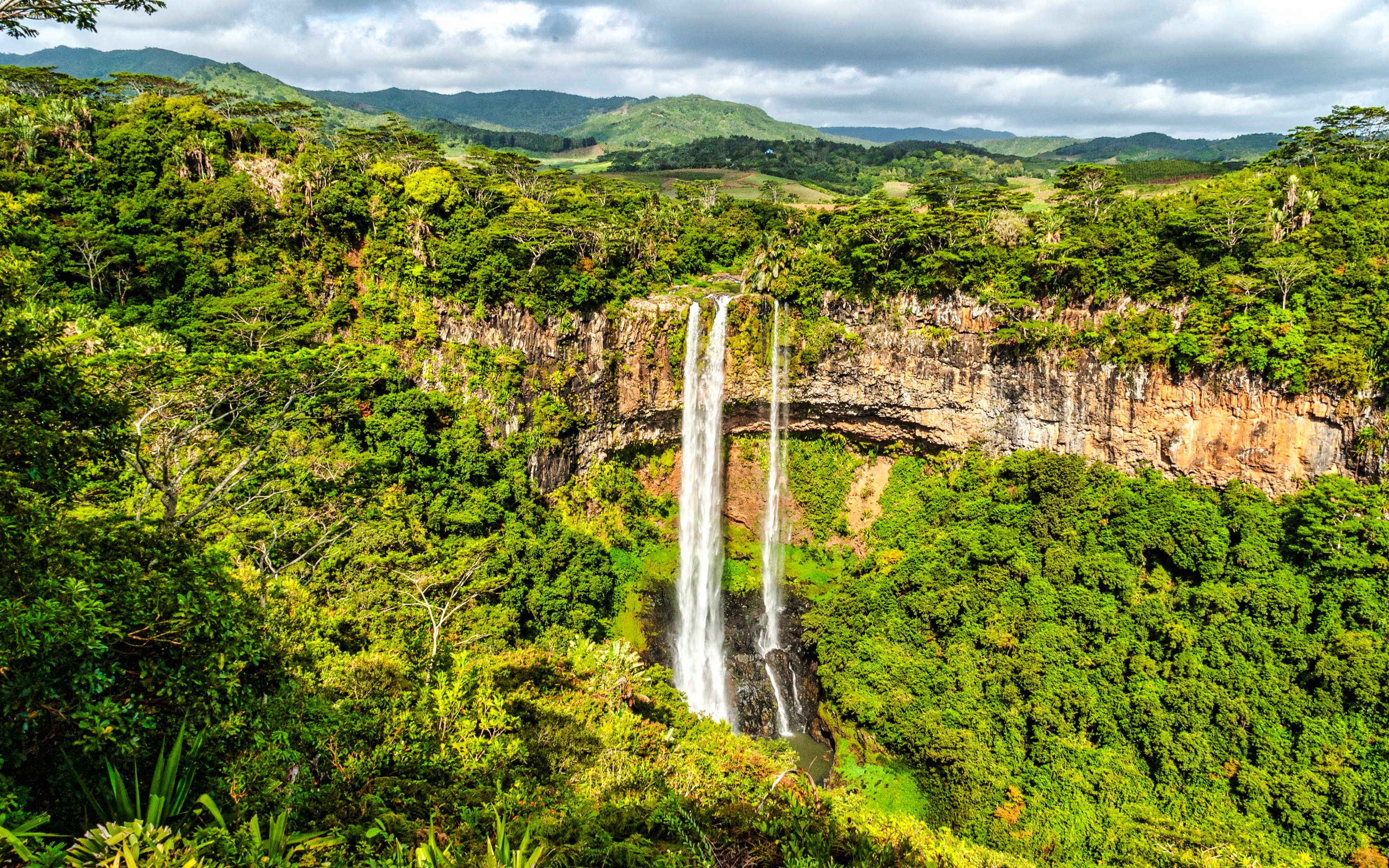 Alexandra Falls cascading through lush greenery in Mauritius.