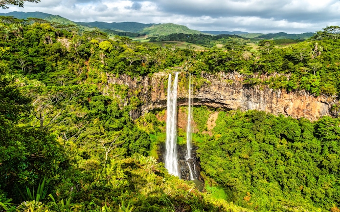 Alexandra Falls cascading through lush greenery in Mauritius.