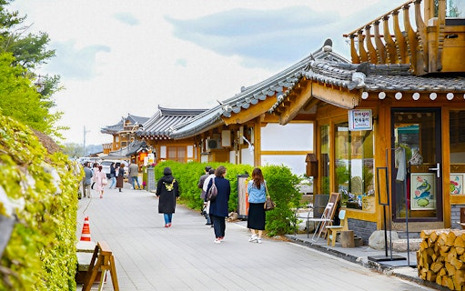 Traditional Korean houses along a street in Gyeongju, South Korea, part of a UNESCO World Heritage Tour.