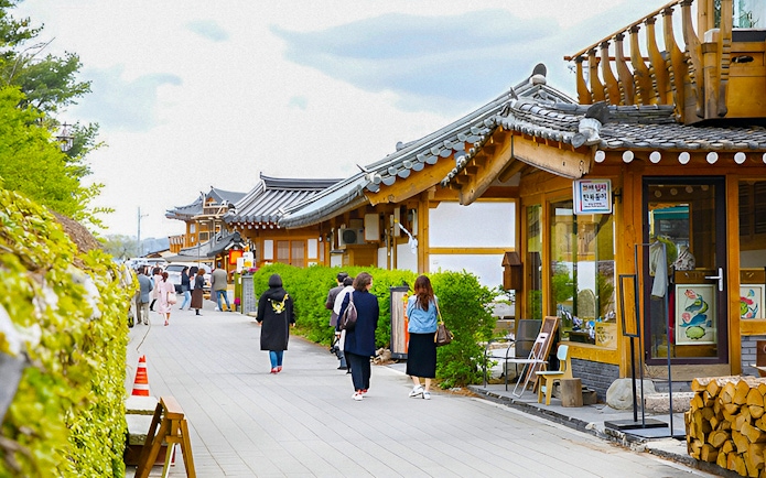 Traditional Korean houses along a street in Gyeongju, South Korea, part of a UNESCO World Heritage Tour.