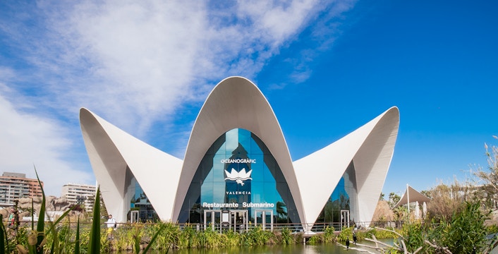 Oceanogràfic Valencia entrance with unique architecture and surrounding pond.