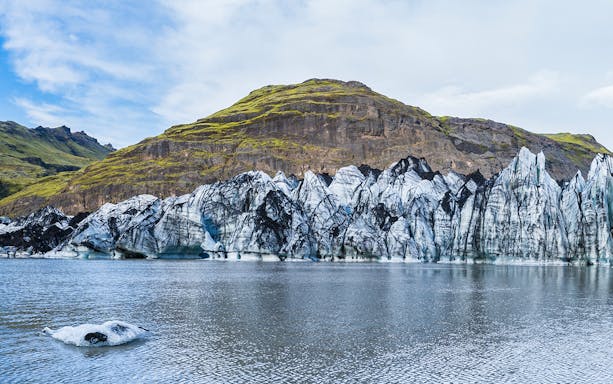 Sólheimajökull Glacier with ice formations and surrounding landscape on South Coast Half Day Tour.