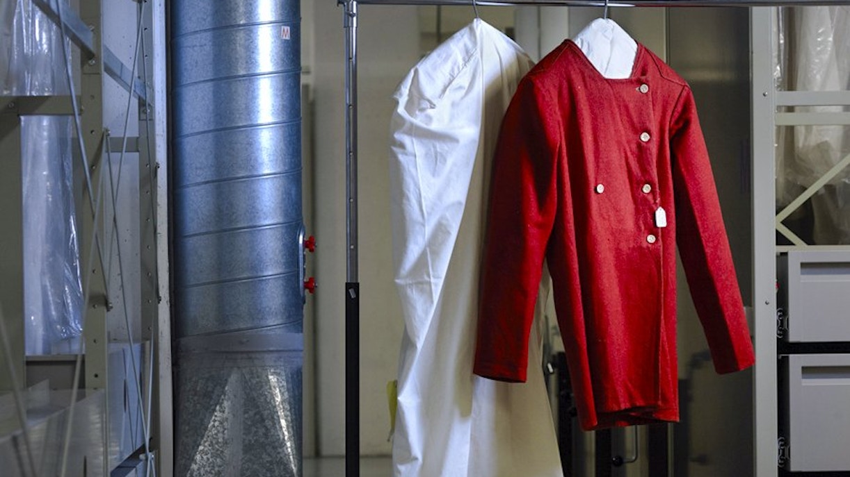 Red historical garment on display at Palais Galliera, Paris.