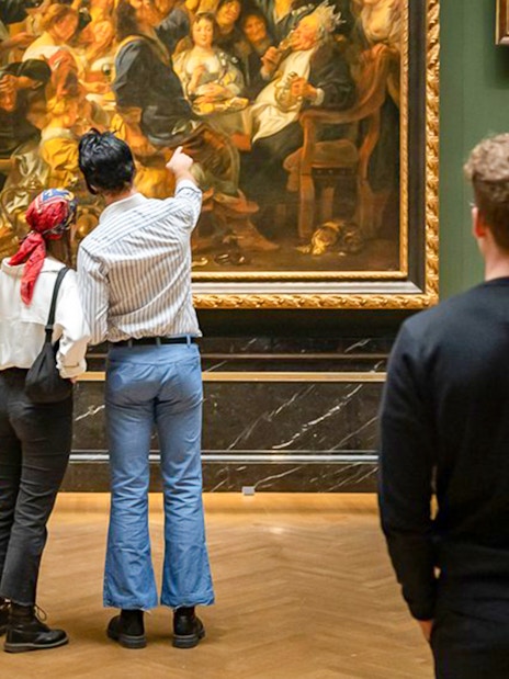 Guests admiring paintings inside Kunsthistorisches Museum Vienna.
