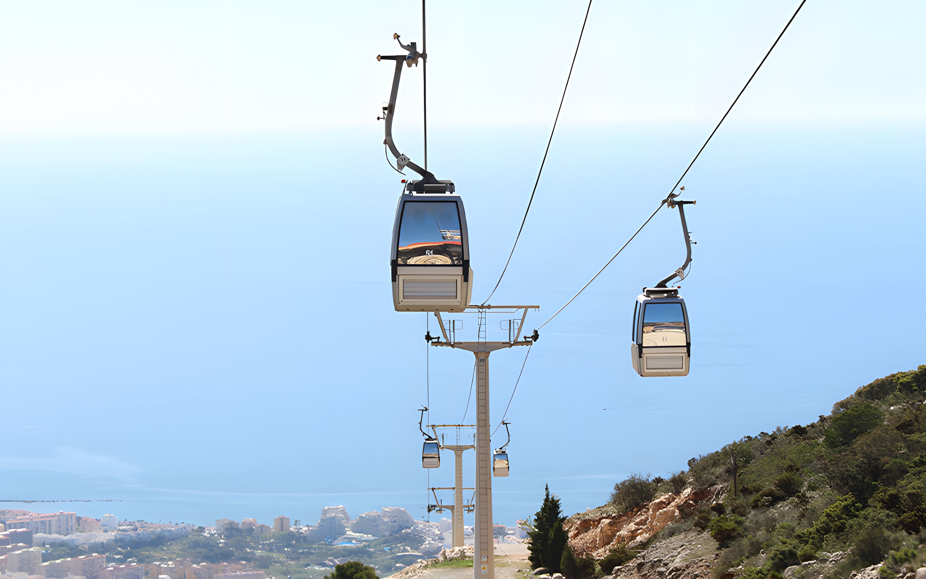 Benalmadena Cable Car ascending over coastal landscape in Spain.