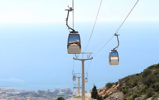 Benalmadena Cable Car ascending over coastal landscape in Spain.