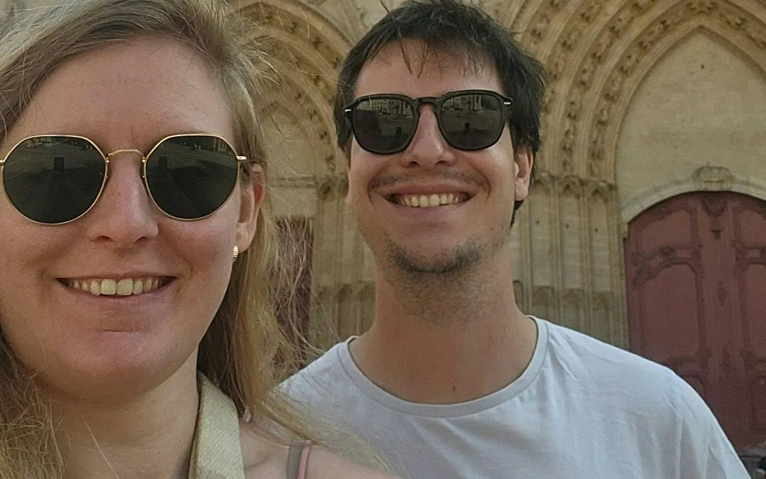 Visitors enjoying Lyon Old Town with historic architecture in the background.