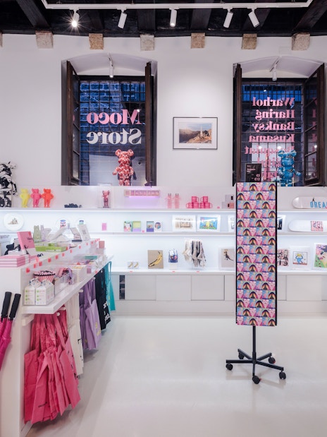 Moco Museum Barcelona gift shop with colorful merchandise and art displays.