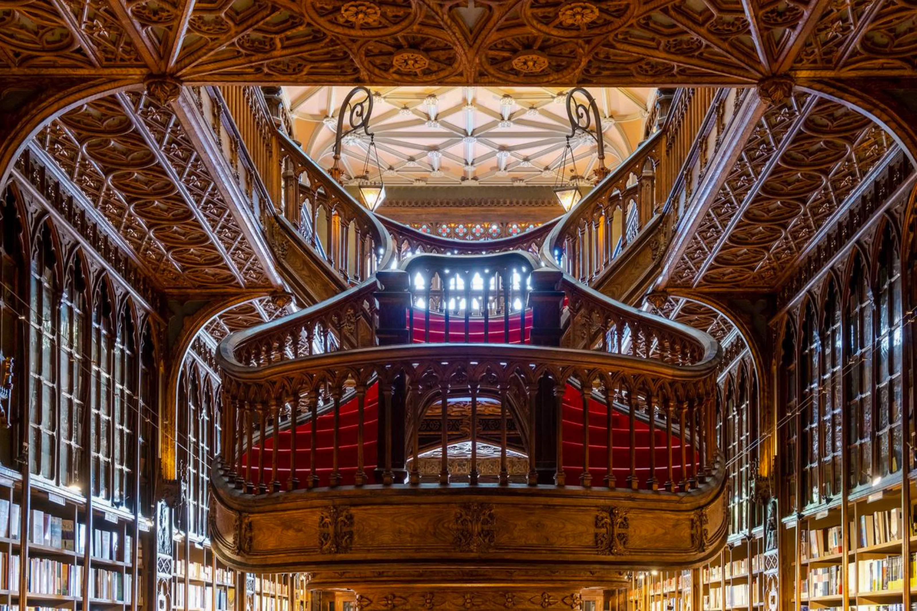 Intricate wooden staircase inside Livraria Lello, Porto.