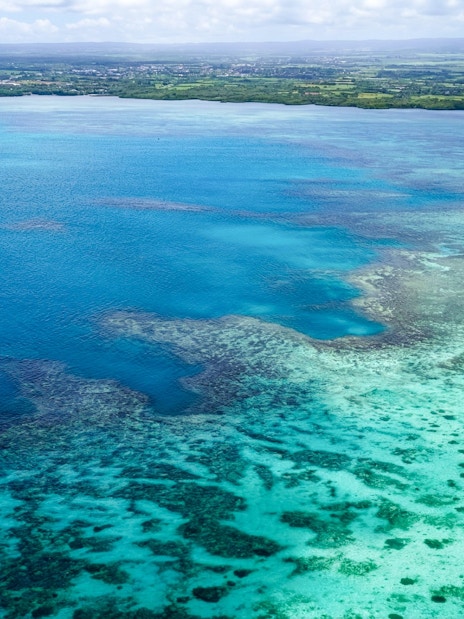 Aerial view of turquoise waters and coastline on the Short Amber Route Seaplane Tour, Mauritius.