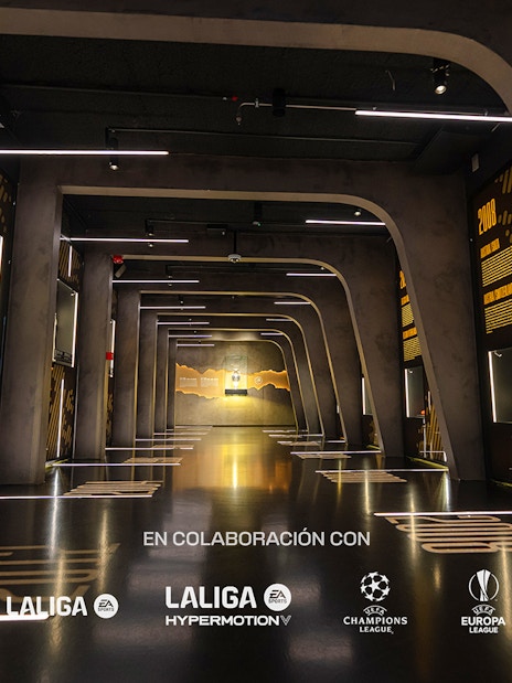 Interiors of the Home of Football Museum in Madrid with illuminated displays and exhibits.