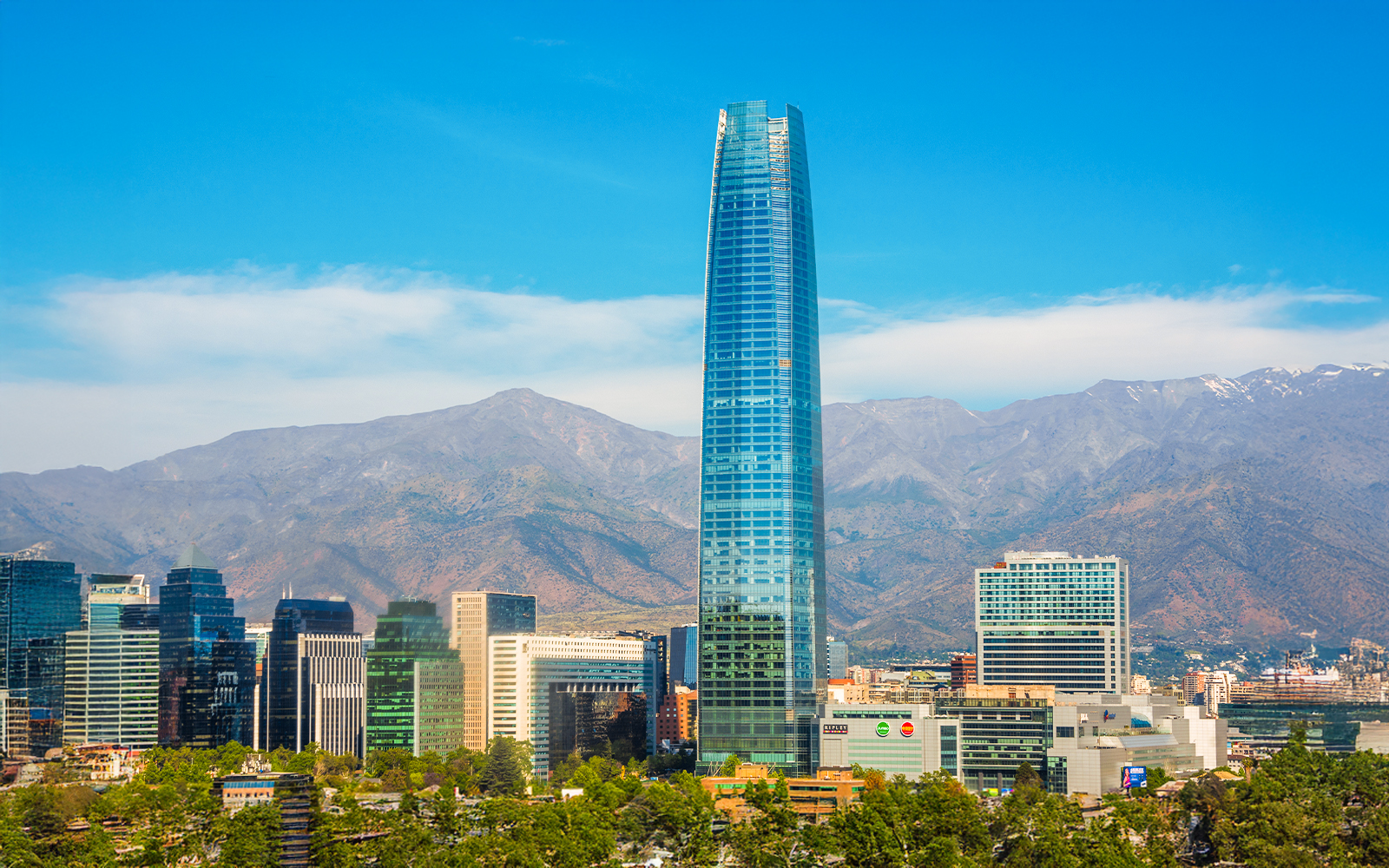 Sky Costanera tower in Santiago with Andes mountains in the background.