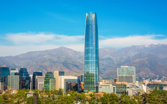 Sky Costanera tower in Santiago with Andes mountains in the background.