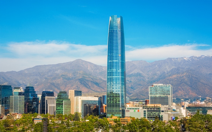 Sky Costanera tower in Santiago with Andes mountains in the background.
