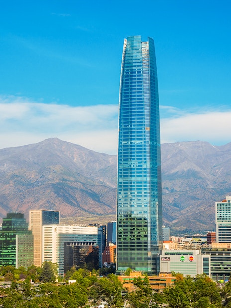 Sky Costanera tower in Santiago with Andes mountains in the background.