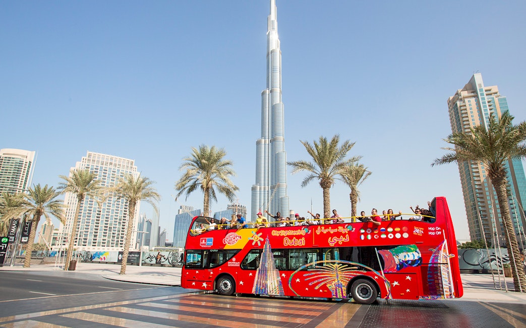 Citysightseeing Dubai bus in front of Burj Khalifa.