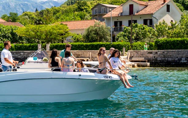 Guests on a speedboat tour near iconic landmarks in New York City.