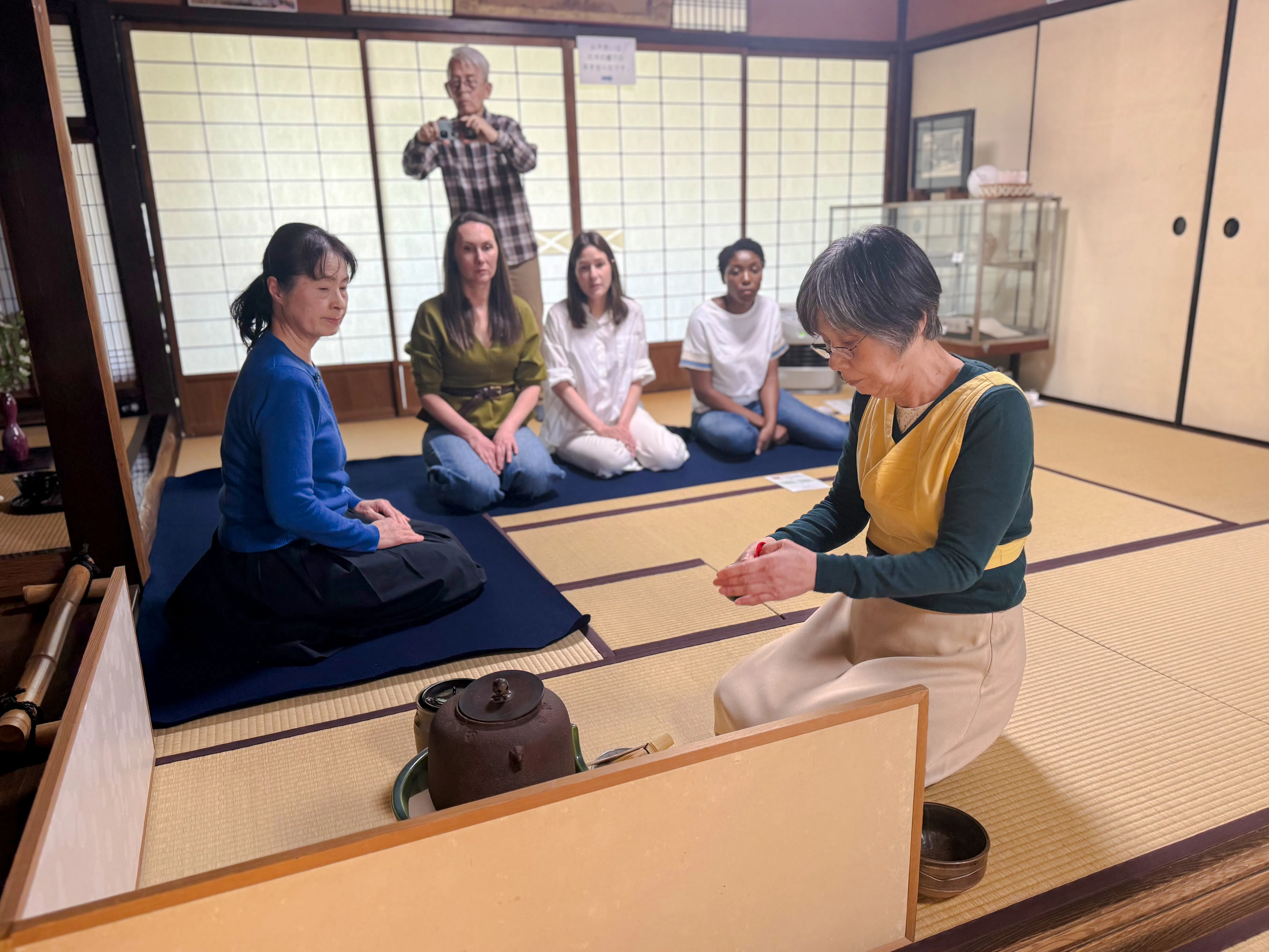 Local tea ceremony at cultural house in Hyogo with participants observing.