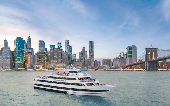 Mimosa brunch cruise at Pier 15 with New York skyline and Brooklyn Bridge.