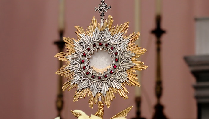 Eucharistic Adoration ceremony inside a historic church.