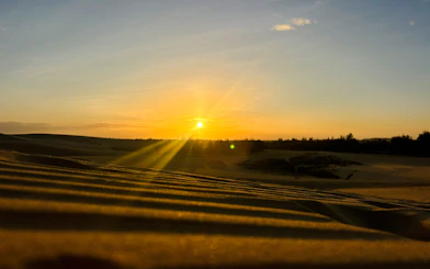 Sunset over sand dunes in Mui Ne during a jeep tour from Ho Chi Minh City.