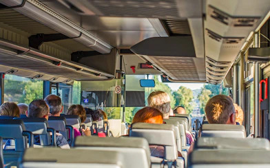 Bus interior with passengers traveling to Krka National Park.