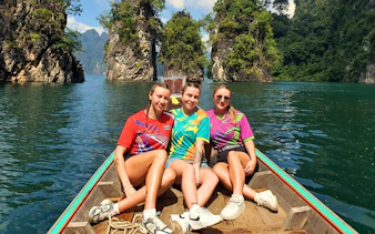 Boat tour through limestone cliffs in Krabi, Thailand.