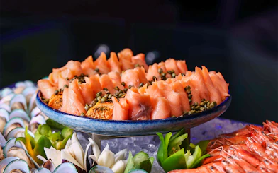 Smoked salmon with capers on a platter, part of Petronas Twin Towers dining experience.
