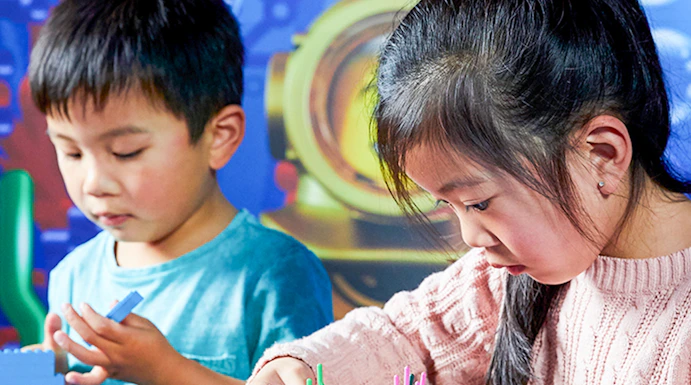 Children building with LEGO bricks at LEGOLAND Discovery Centre, Melbourne.