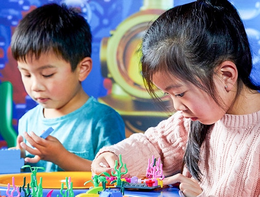 Children building with LEGO bricks at LEGOLAND Discovery Centre, Melbourne.