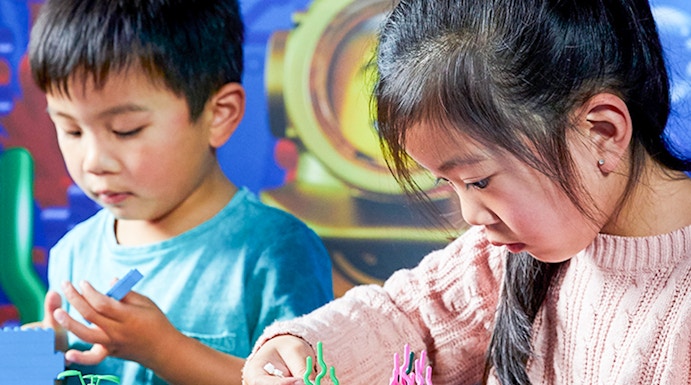Children building with LEGO bricks at LEGOLAND Discovery Centre, Melbourne.