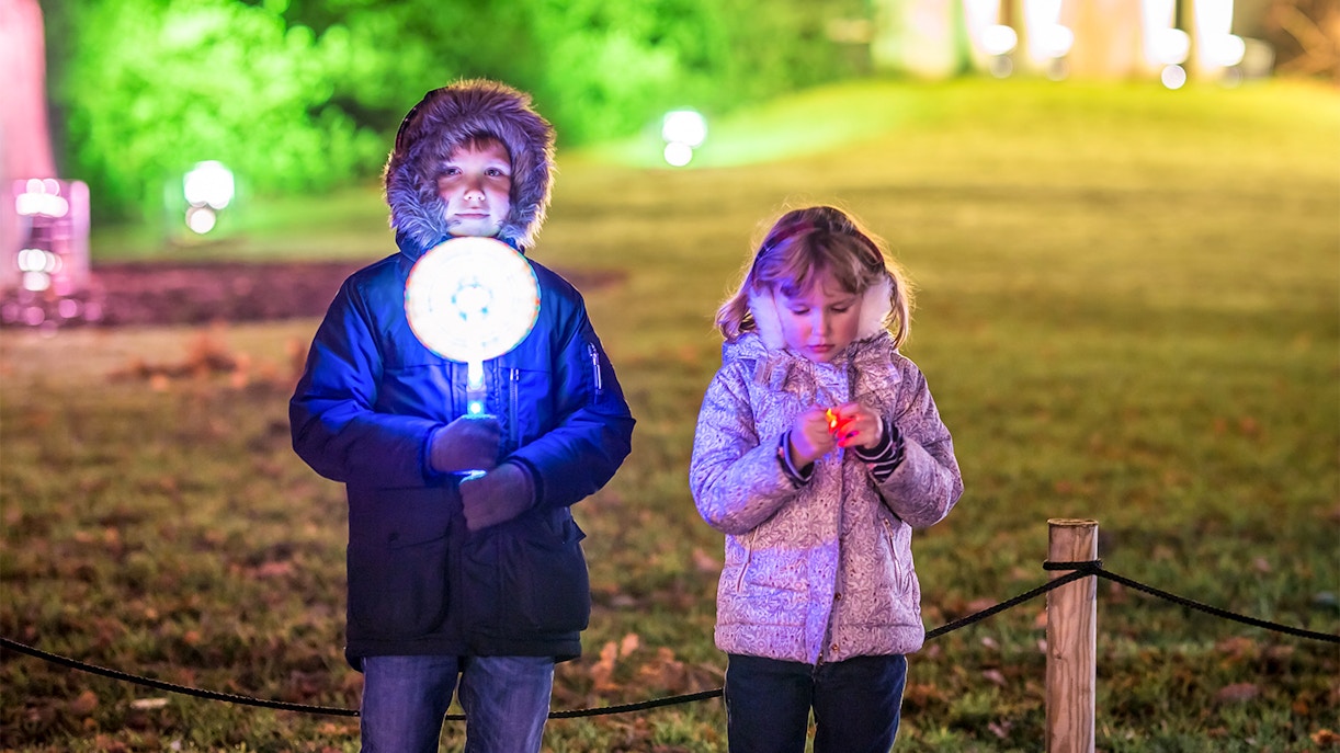 kids wearing warmer clothes in Kew Garden during christmas