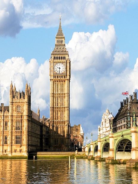 Big Ben and Houses of Parliament viewed from a Thames cruise in London.