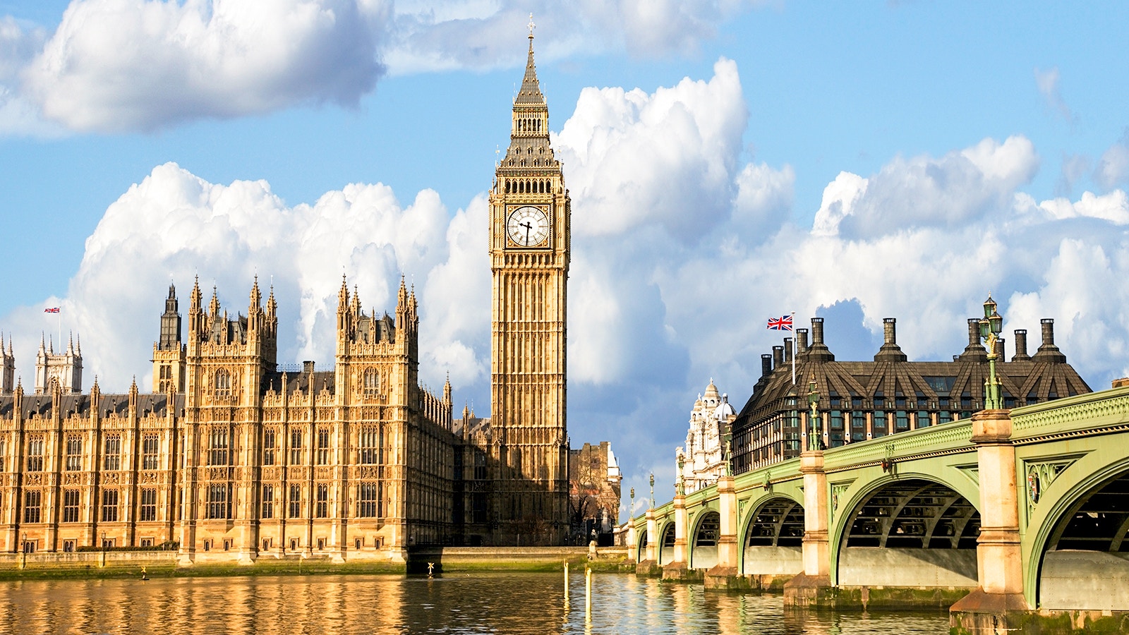 Big Ben and Houses of Parliament viewed from a Thames cruise in London.