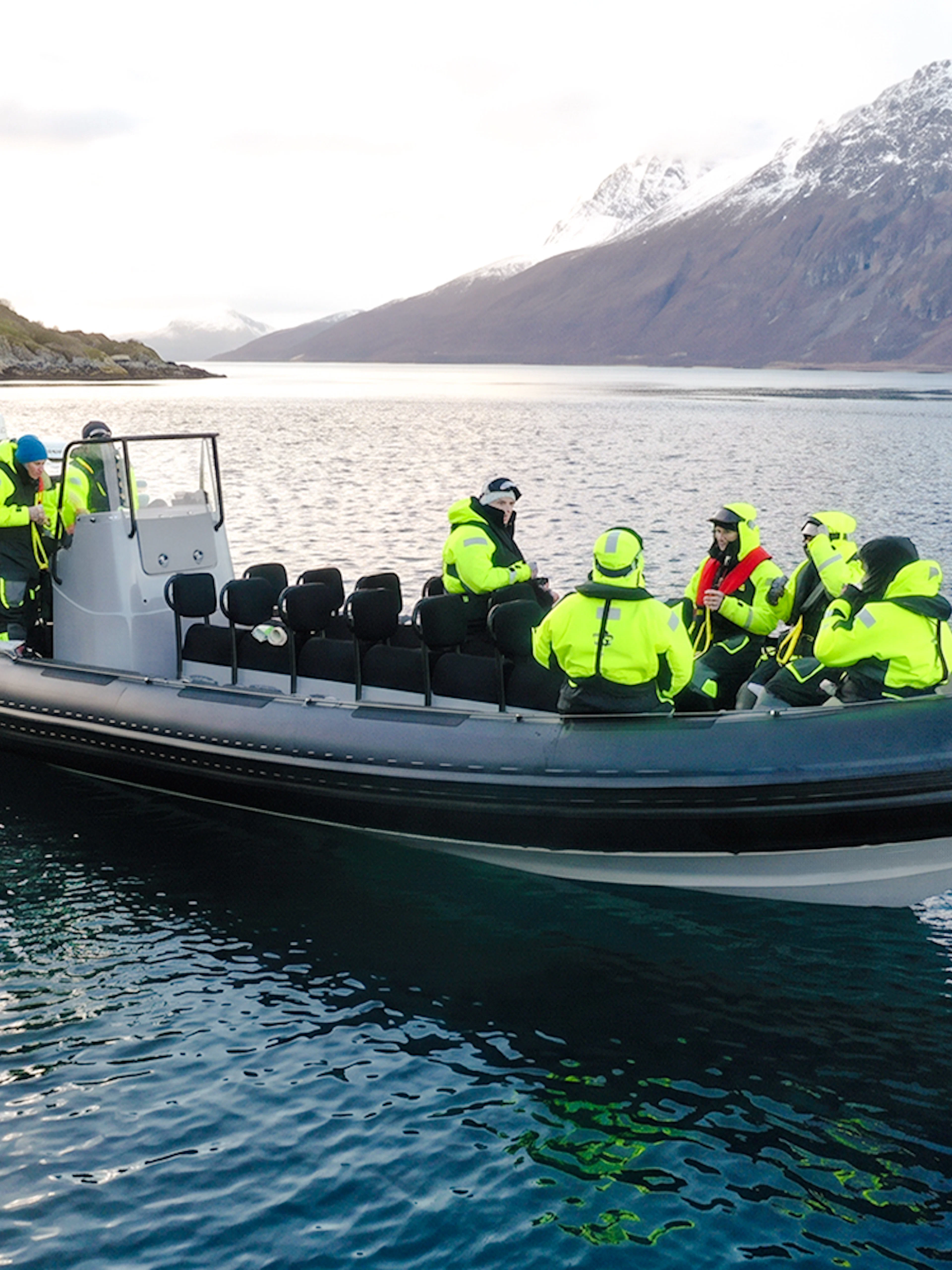 Rib speedboat with passengers on a whale watching cruise in Tromso fjord.