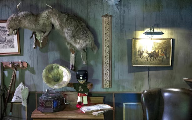 Vintage decor with taxidermy, gramophone, and toy soldier at Tivoli Gardens, Copenhagen.
