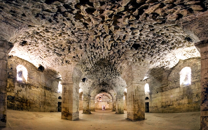 Underground halls of Diocletian's Palace in Split, showcasing ancient stone architecture.