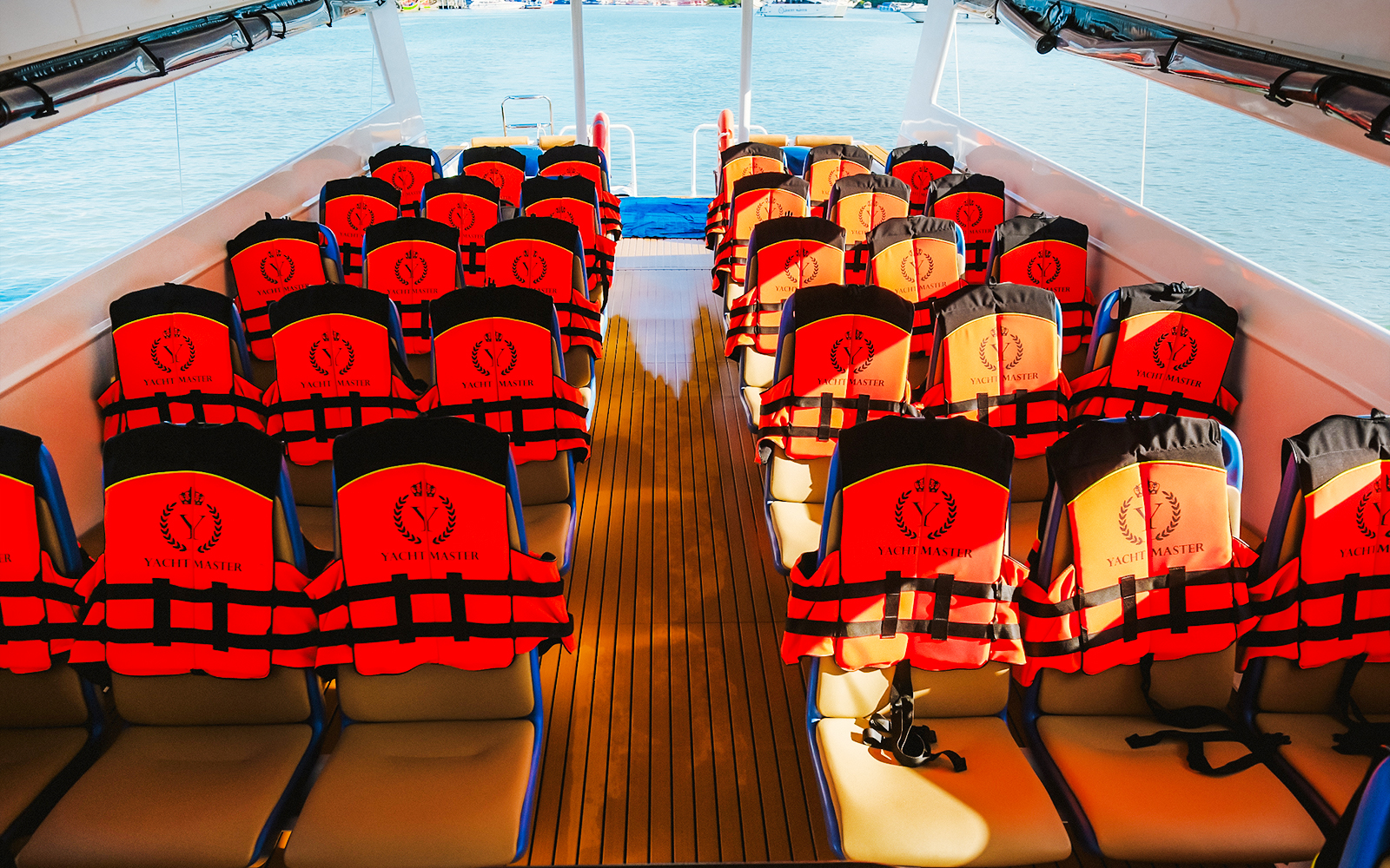 Life jackets on seats inside Premium Speed Catamaran.