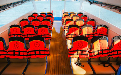 Life jackets on seats inside Premium Speed Catamaran.