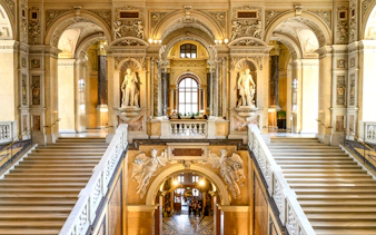 Grand staircase and sculptures inside the Natural History Museum, Vienna.