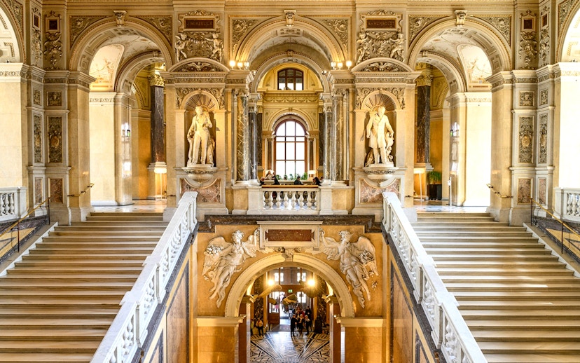 Grand staircase and sculptures inside the Natural History Museum, Vienna.