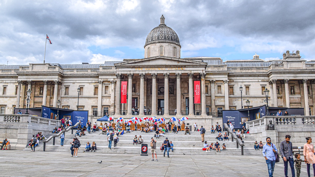 Trafalgar Square with visitors in front of the National Gallery, London.
