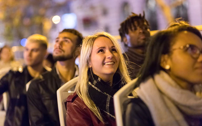 Passengers enjoying the Big Bus Paris Panoramic Night Tour.