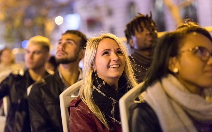 Passengers enjoying the Big Bus Paris Panoramic Night Tour.