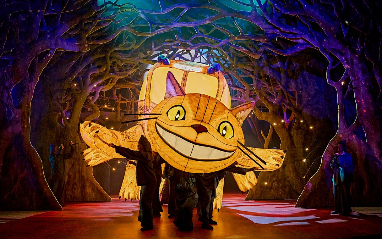 Stage performance of My Neighbour Totoro with Catbus puppet in West End show.