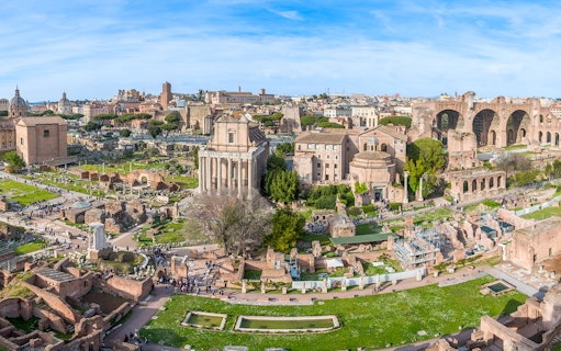 Roman Forum and Palatine Hill ruins in Rome, Italy, with ancient temples and arches.