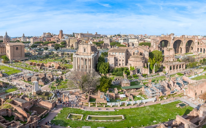 Roman Forum and Palatine Hill ruins in Rome, Italy, with ancient temples and arches.