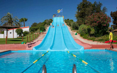 Visitors enjoying the Super Surf slide at Aqualand Algarve.