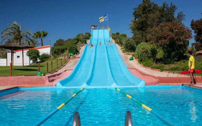 Visitors enjoying the Super Surf slide at Aqualand Algarve.